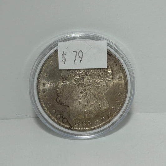 1885 Morgan Silver Dollar in circular protector