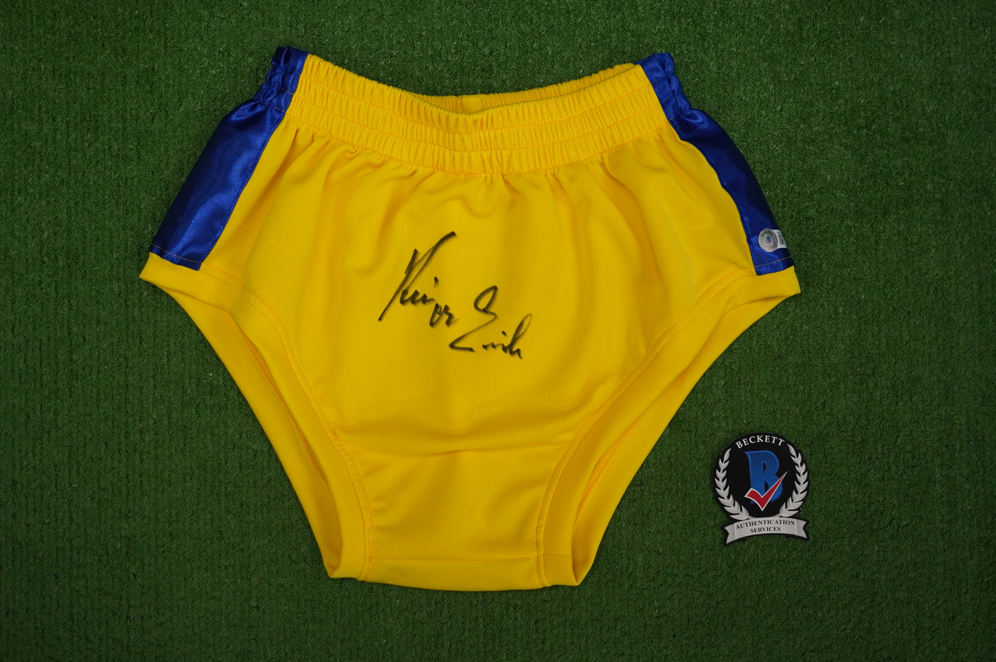 KEVIN VON ERICH SIGNED WRESTLING YELLOW and BLUE TRUNKS BAS COA