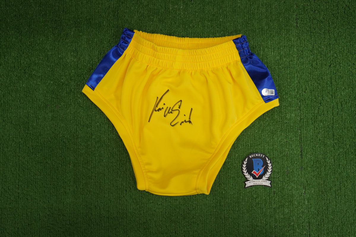 KEVIN VON ERICH SIGNED WRESTLING YELLOW and BLUE TRUNKS BAS COA