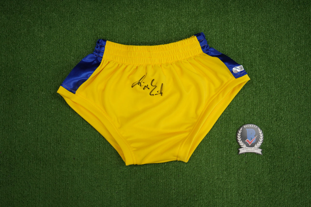 KEVIN VON ERICH SIGNED WRESTLING YELLOW and BLUE TRUNKS BAS COA
