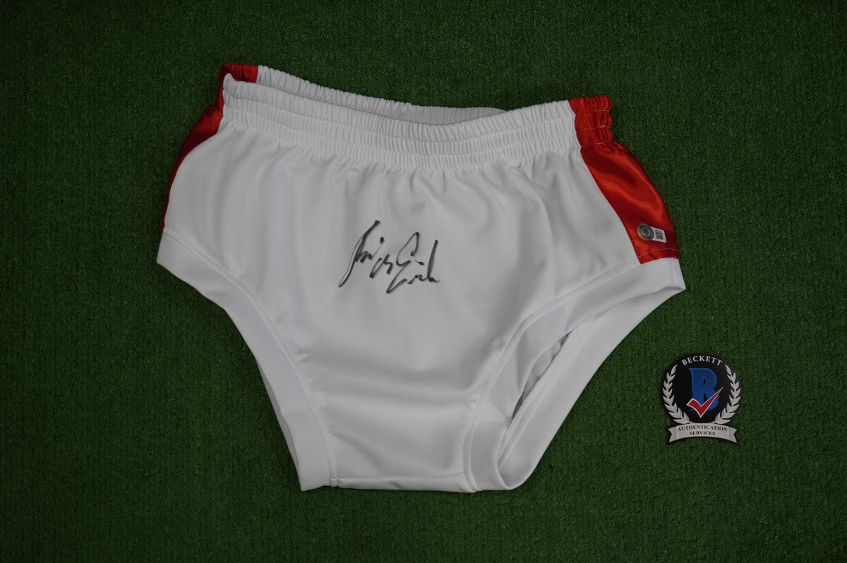 KEVIN VON ERICH SIGNED WHITE WRESTLING TRUNKS BAS COA