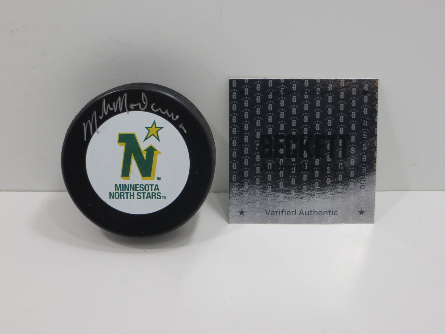 MIKE MODANO MINNESOTA NORTH STARS SIGNED HOCKEY PUCK Dallas BAS COA