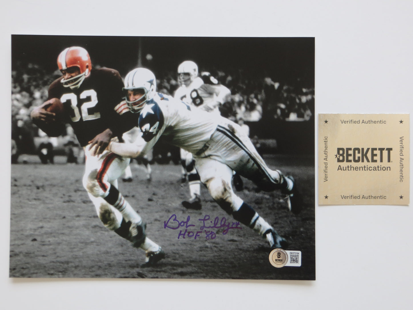 BOB LILLY DALLAS COWBOYS 8x10 PHOTO Tackling Jim Brown BAS