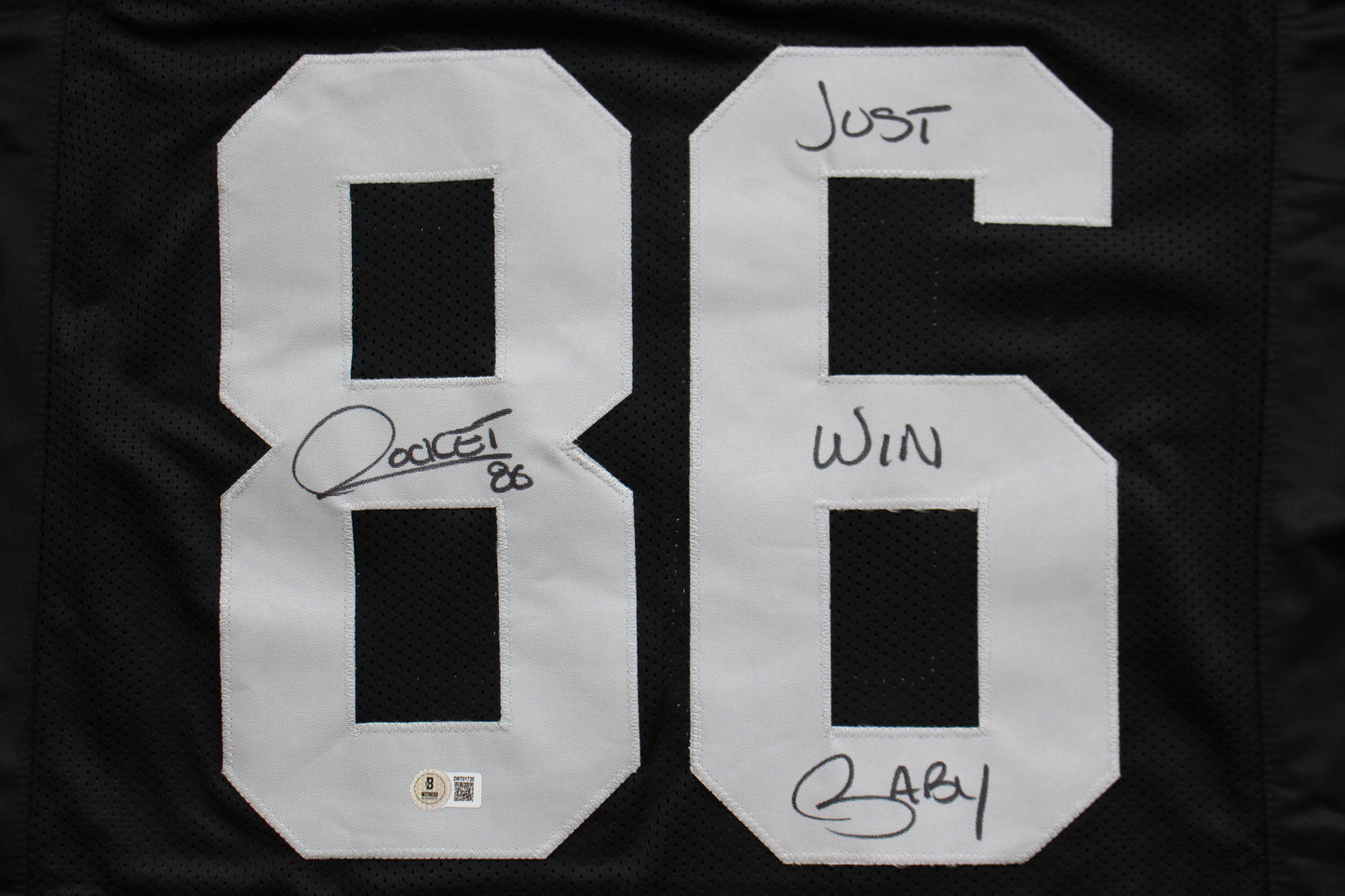ROCKET ISMAIL RAIDERS SIGNED BLACK JERSEY w/JUST WIN BABY BAS COA