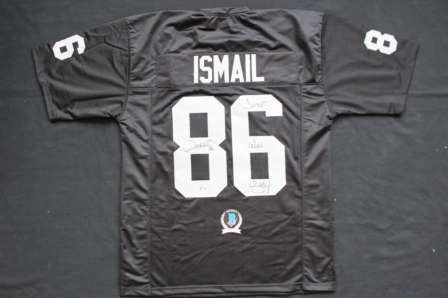 ROCKET ISMAIL RAIDERS SIGNED BLACK JERSEY w/JUST WIN BABY BAS COA