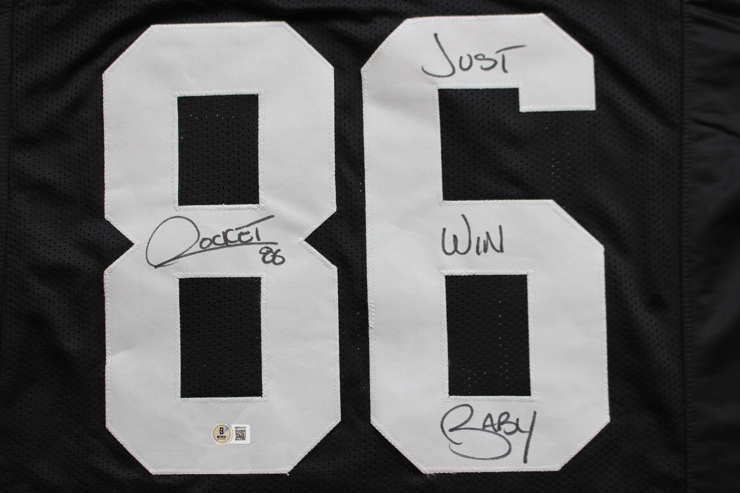ROCKET ISMAIL RAIDERS SIGNED BLACK JERSEY w/JUST WIN BABY BAS COA