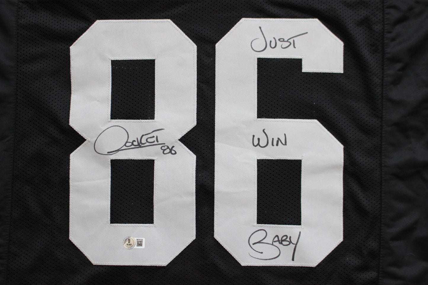 ROCKET ISMAIL RAIDERS SIGNED BLACK JERSEY w/JUST WIN BABY BAS COA