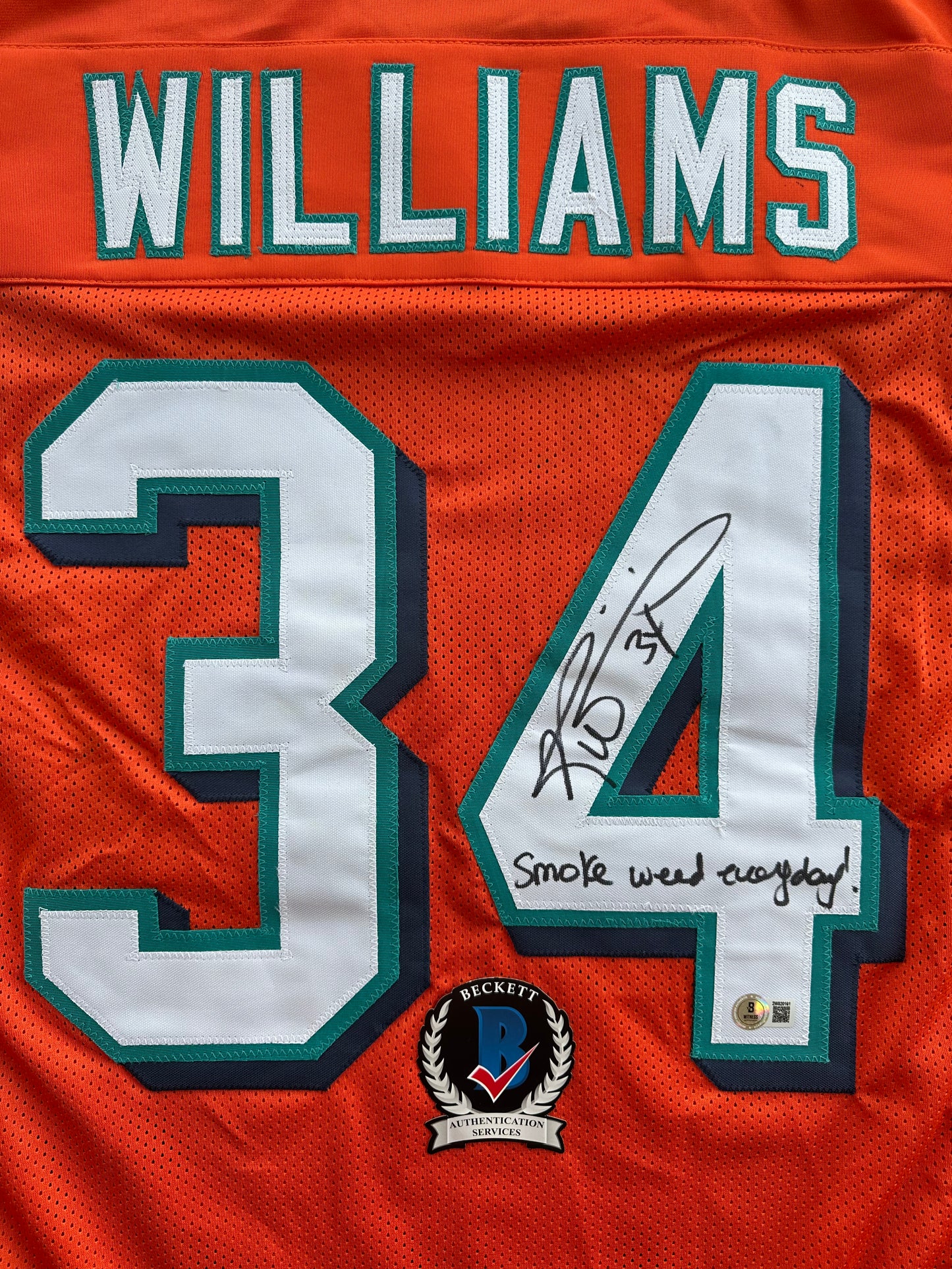 RICKY WILLIAMS ORANGE FOOTBALL JERSEY Miami Dolphins w/"Smoke Weed Everyday" BAS