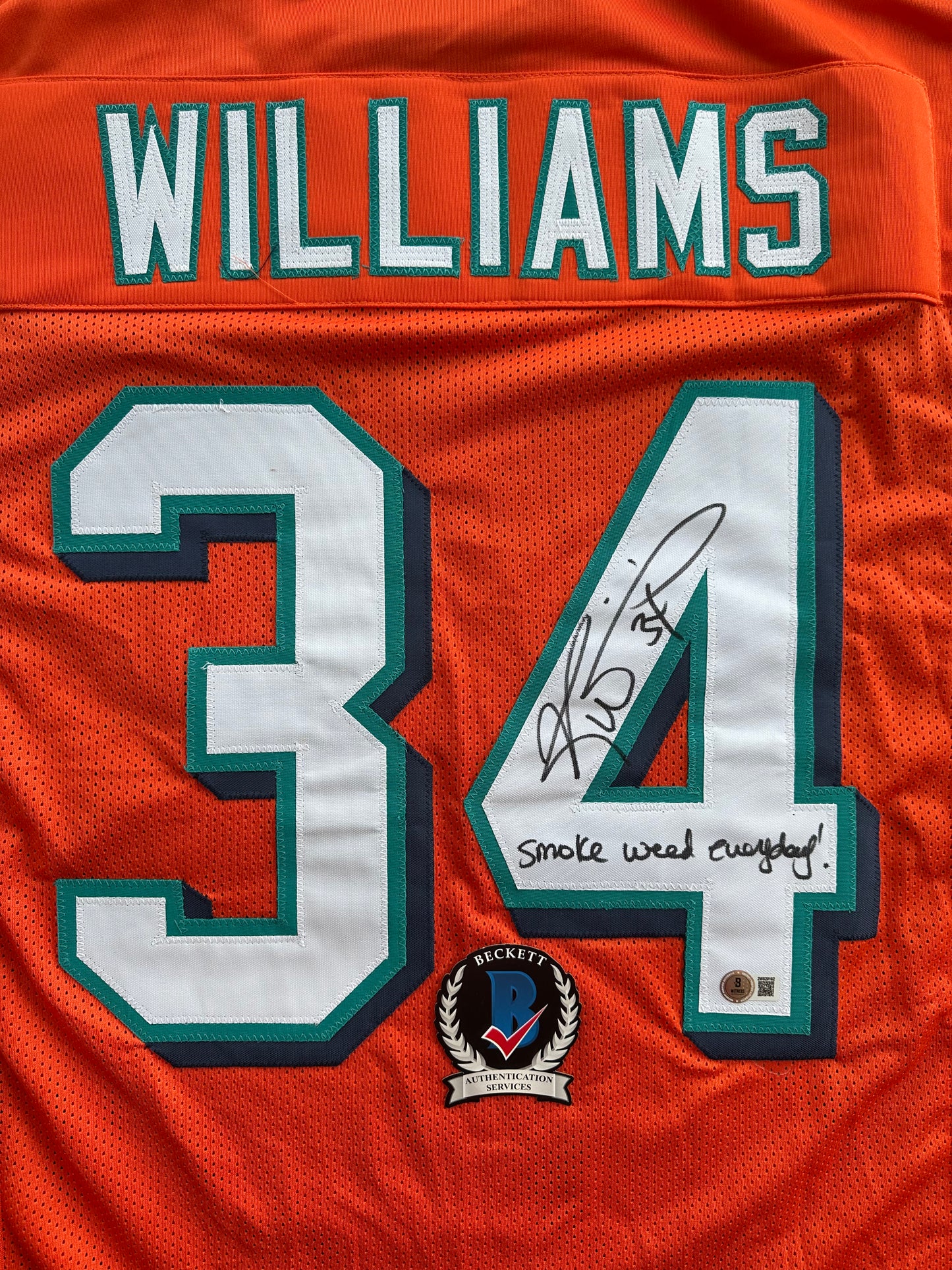 RICKY WILLIAMS ORANGE FOOTBALL JERSEY Miami Dolphins w/"Smoke Weed Everyday" BAS