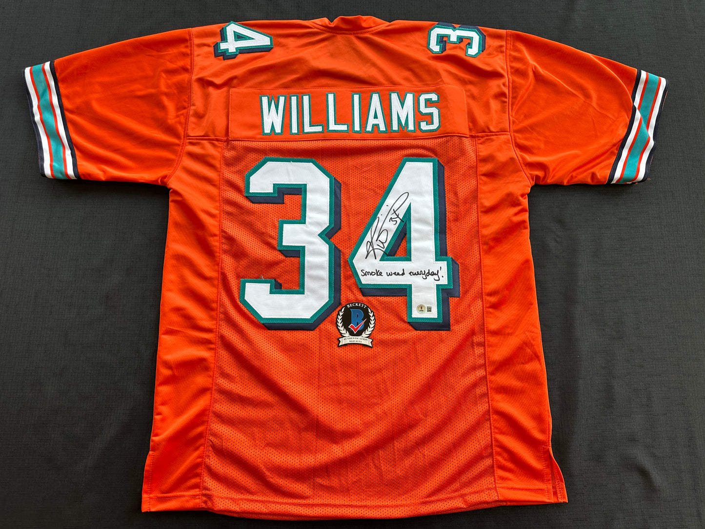 RICKY WILLIAMS ORANGE FOOTBALL JERSEY Miami Dolphins w/"Smoke Weed Everyday" BAS