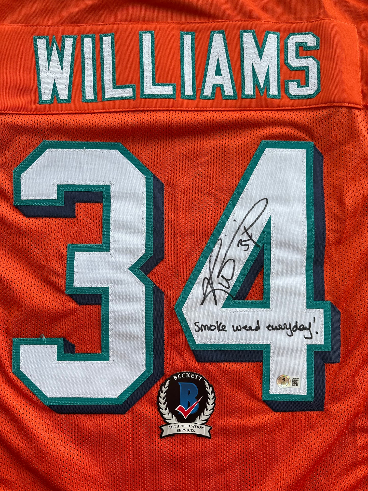 RICKY WILLIAMS ORANGE FOOTBALL JERSEY Miami Dolphins w/"Smoke Weed Everyday" BAS