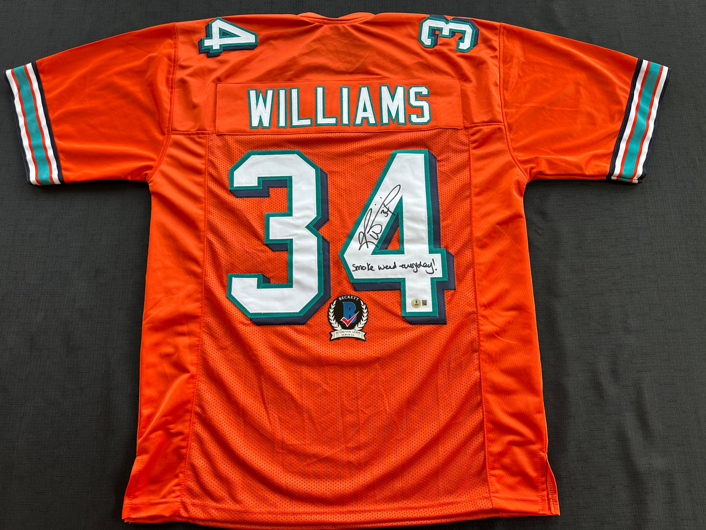 RICKY WILLIAMS ORANGE FOOTBALL JERSEY Miami Dolphins w/"Smoke Weed Everyday" BAS