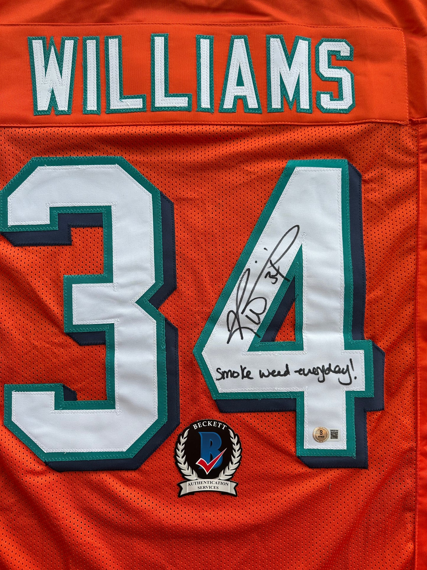 RICKY WILLIAMS ORANGE FOOTBALL JERSEY Miami Dolphins w/"Smoke Weed Everyday" BAS
