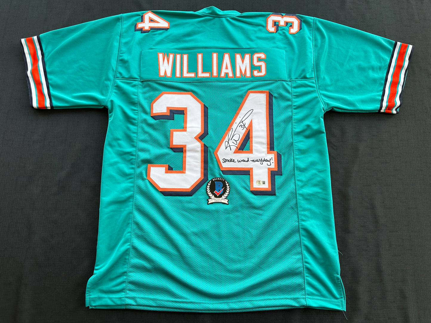 RICKY WILLIAMS SIGNED TEAL FOOTBALL JERSEY Miami Dolphins w/"Smoke Weed Everyday" BAS