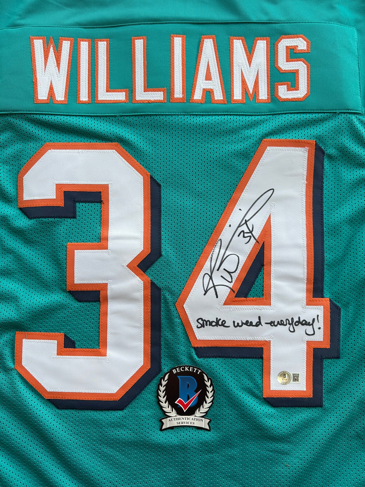 RICKY WILLIAMS SIGNED TEAL FOOTBALL JERSEY Miami Dolphins w/"Smoke Weed Everyday" BAS