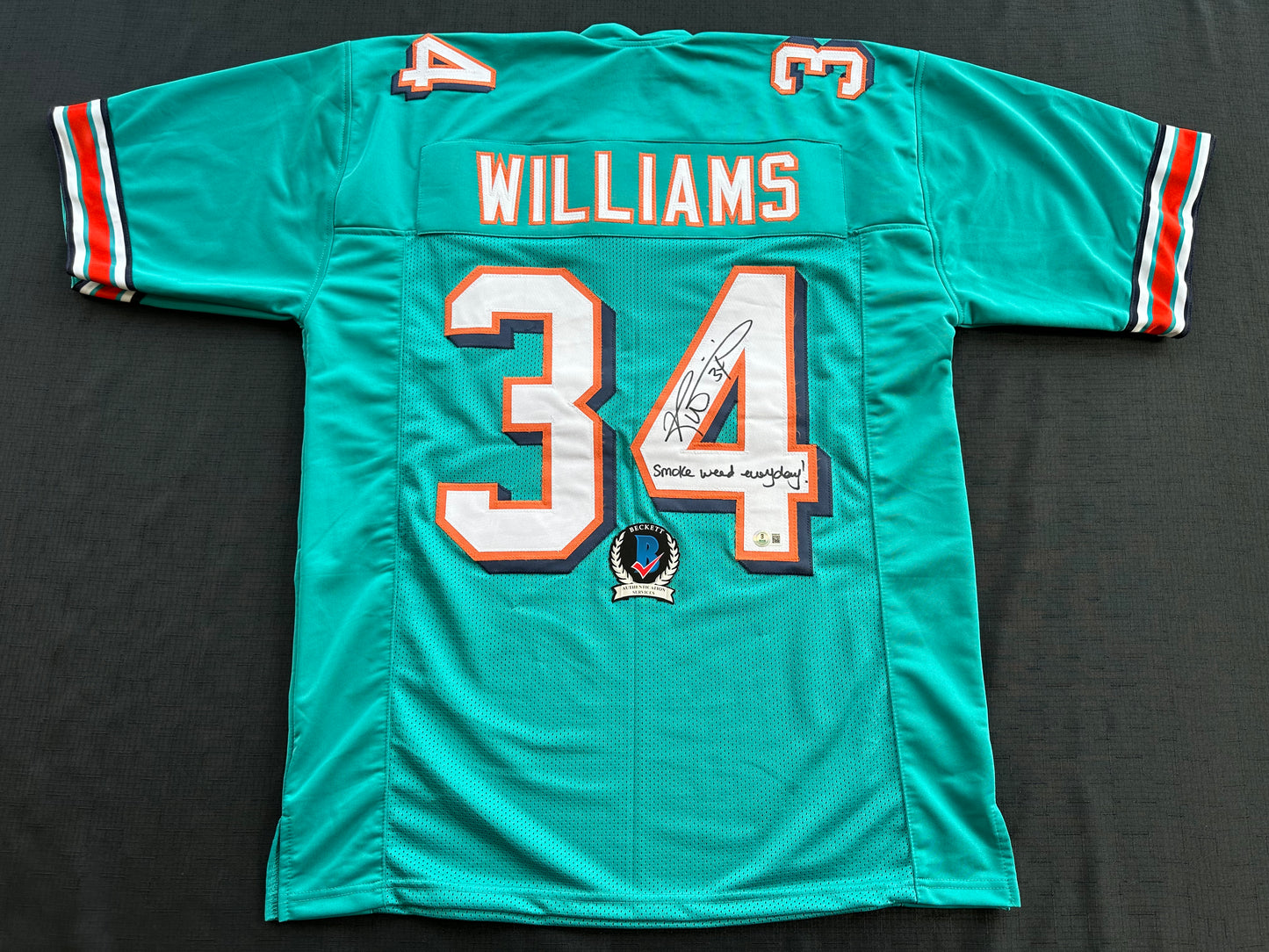 RICKY WILLIAMS SIGNED TEAL FOOTBALL JERSEY Miami Dolphins w/"Smoke Weed Everyday" BAS