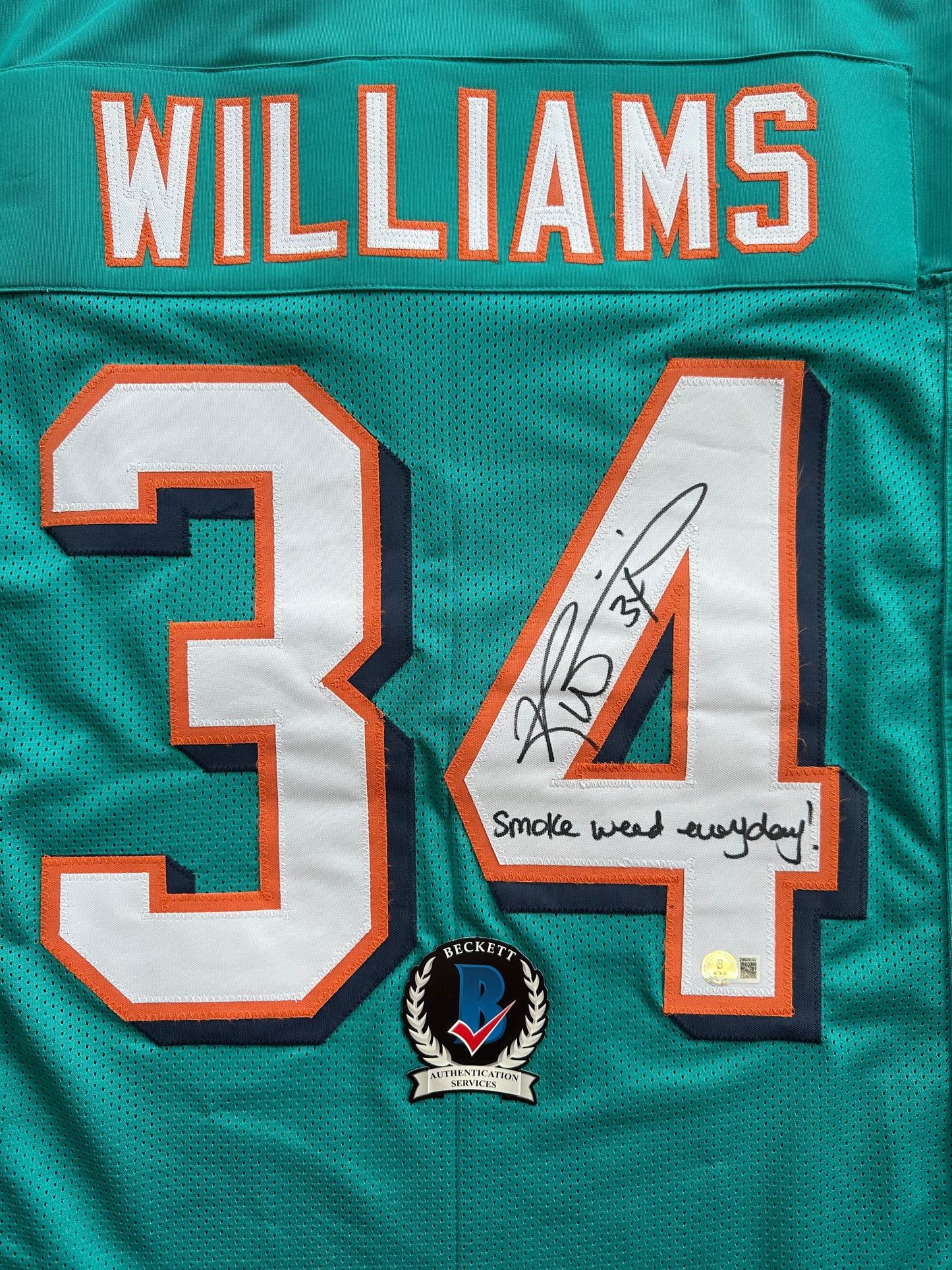 RICKY WILLIAMS SIGNED TEAL FOOTBALL JERSEY Miami Dolphins w/"Smoke Weed Everyday" BAS