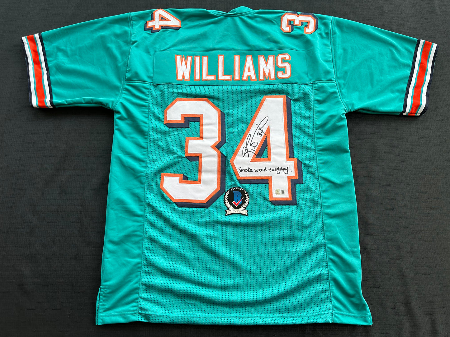 RICKY WILLIAMS SIGNED TEAL FOOTBALL JERSEY Miami Dolphins w/"Smoke Weed Everyday" BAS
