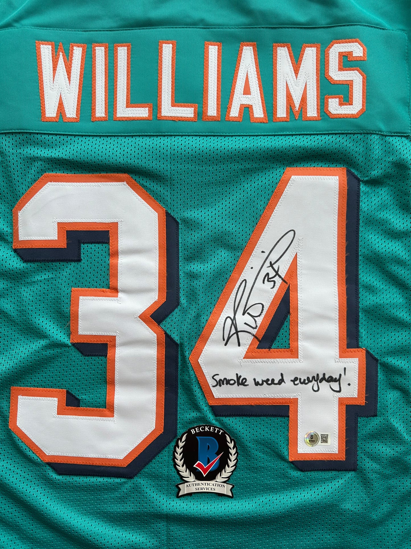 RICKY WILLIAMS SIGNED TEAL FOOTBALL JERSEY Miami Dolphins w/"Smoke Weed Everyday" BAS