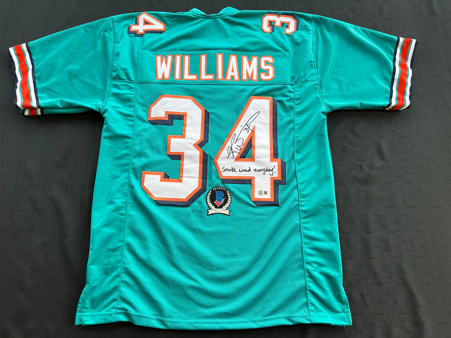 RICKY WILLIAMS SIGNED TEAL FOOTBALL JERSEY Miami Dolphins w/"Smoke Weed Everyday" BAS