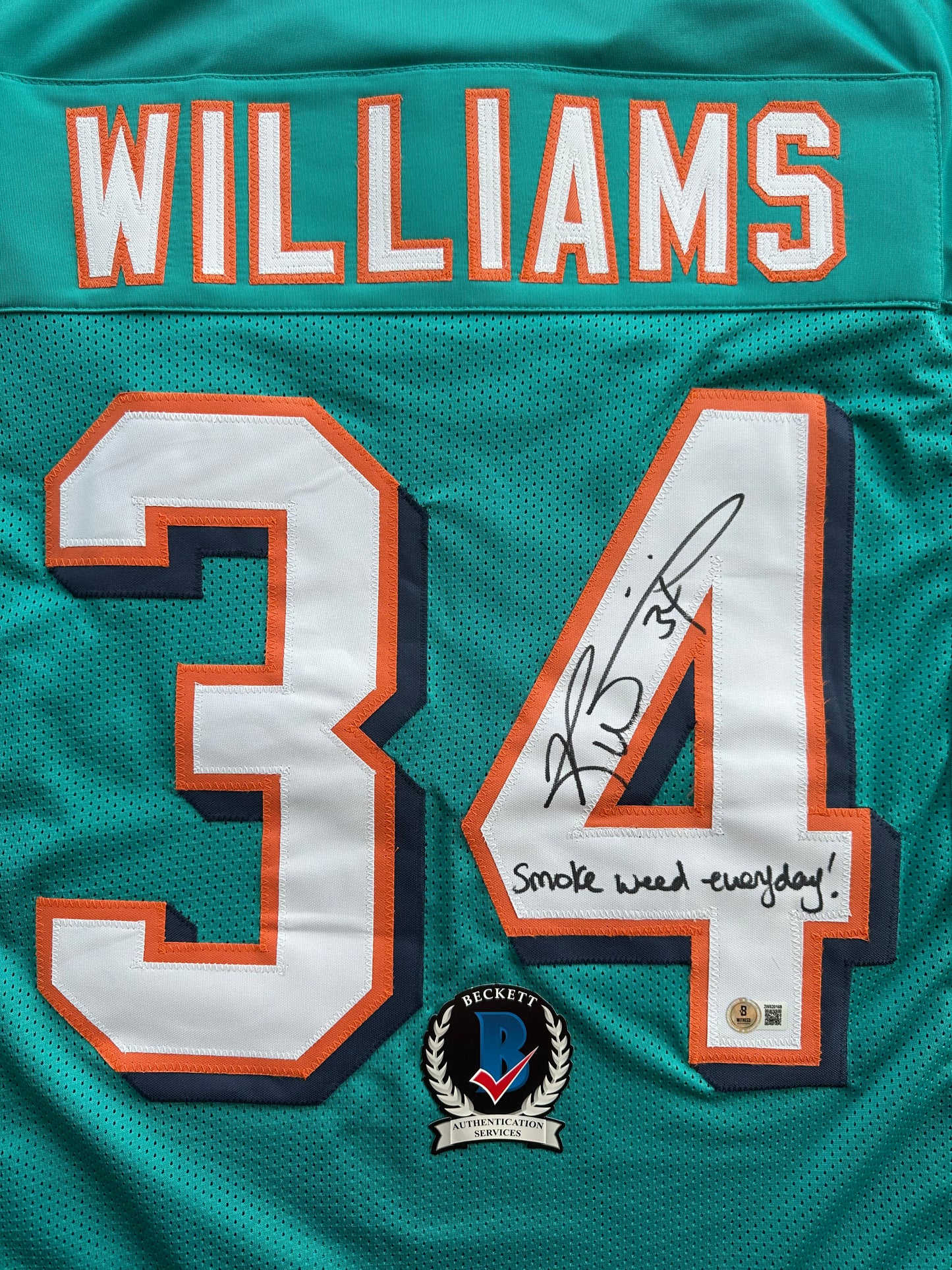 RICKY WILLIAMS SIGNED TEAL FOOTBALL JERSEY Miami Dolphins w/"Smoke Weed Everyday" BAS