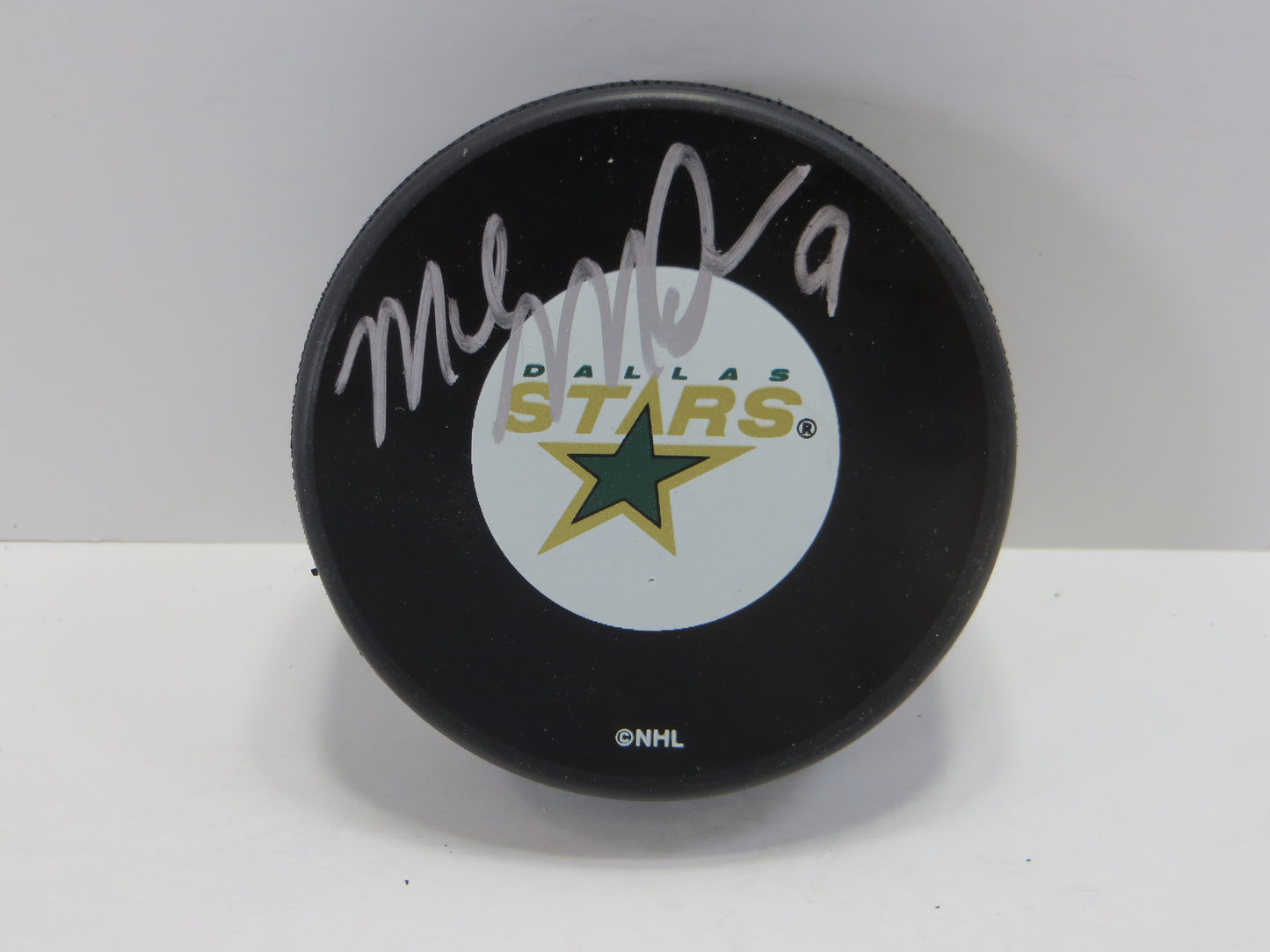 MIKE MODANO SIGNED OLD LOGO PUCK JSA